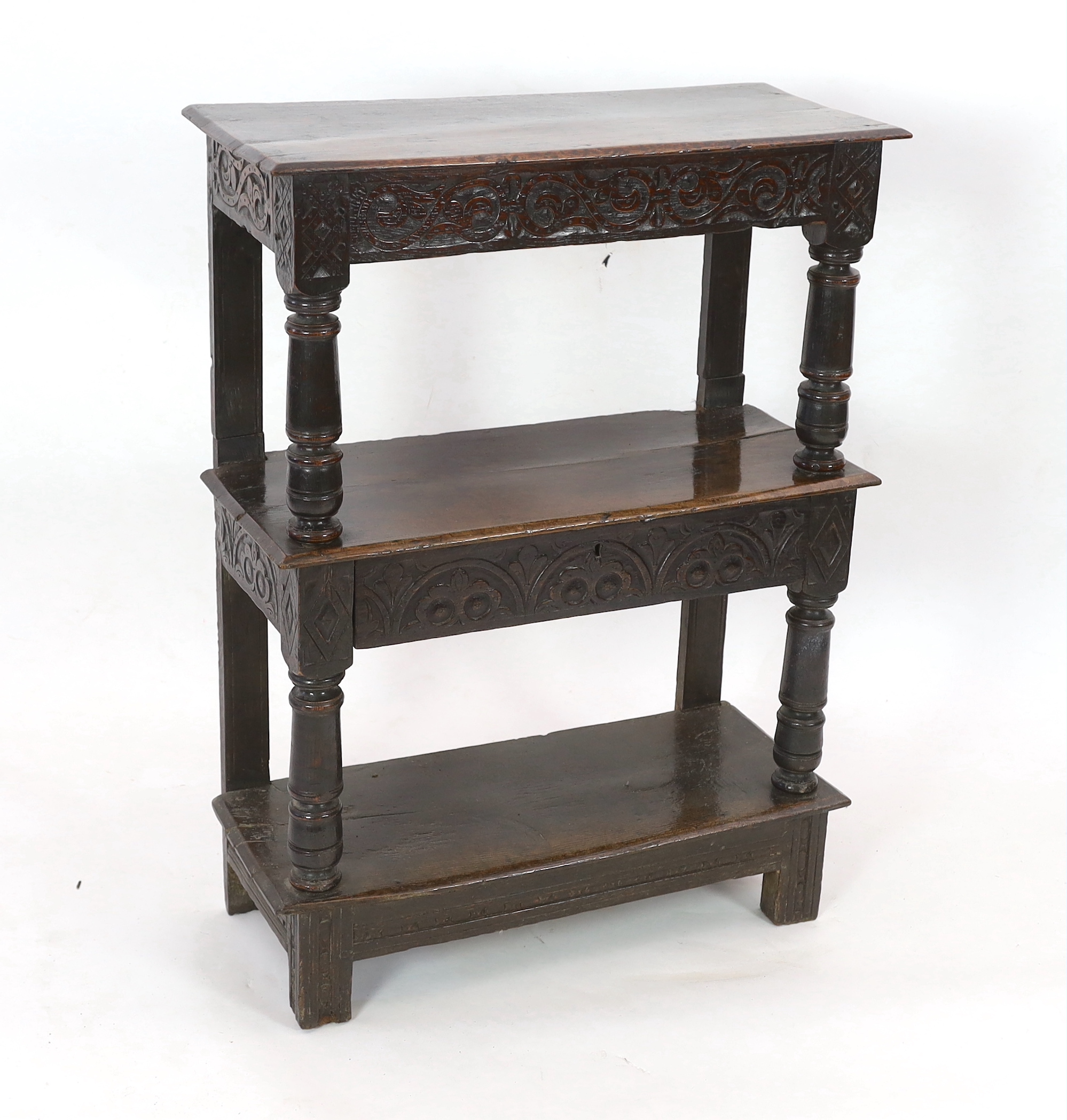 An early 17th century oak three tier buffet